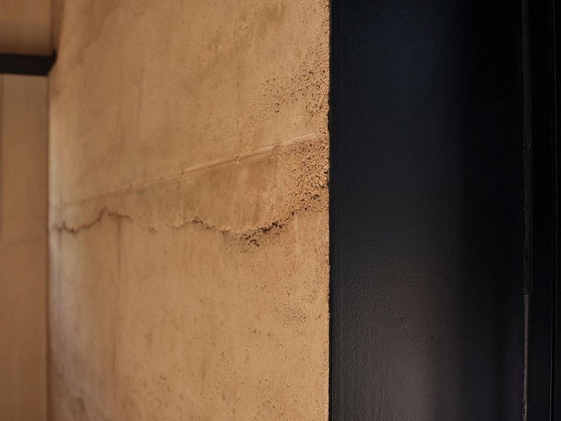 Rammed earth construction is an ancient technique, blendingtimeless craftsmanship with sustainable innovation. A mixture ofsoil, gravel, cement and water is poured into 24-inch-thick formsand tamped down to half its original height, layer by layer. view