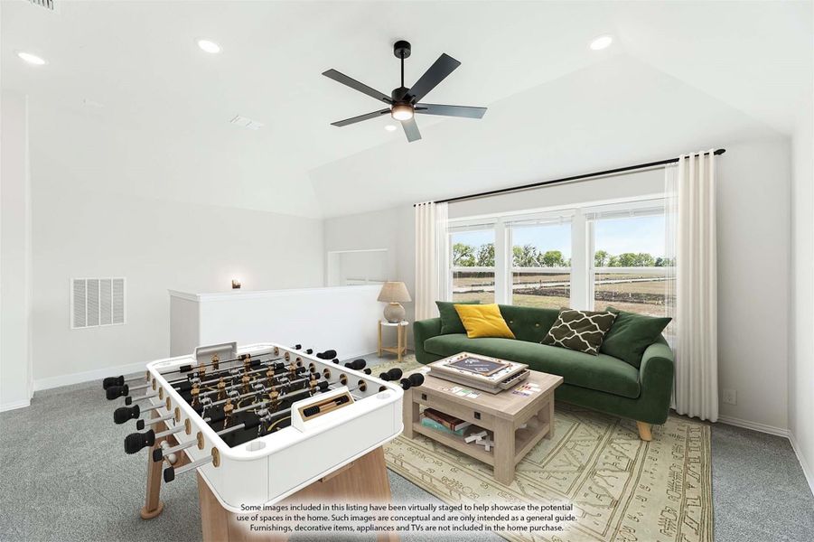 Game room with foosball table, green sofa, vaulted ceiling, and ceiling fan