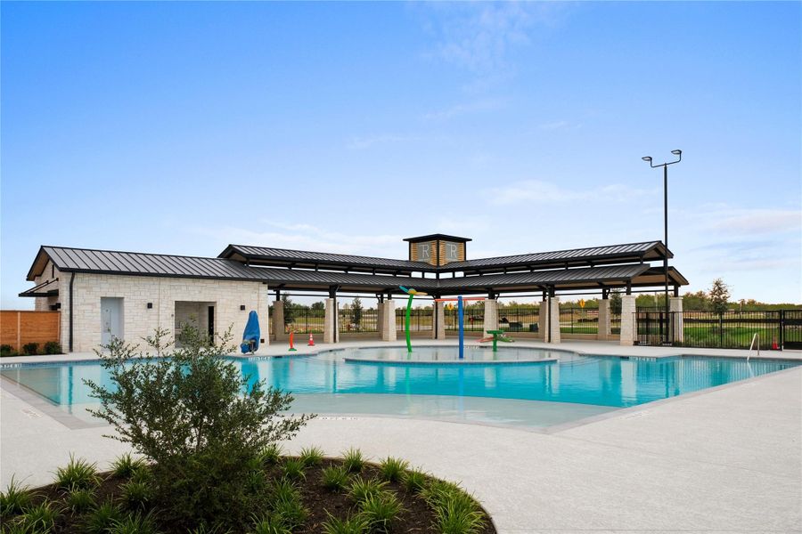 Community pool with a patio