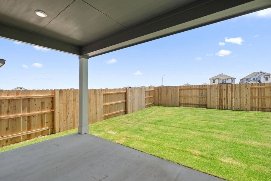 Exterior details and patio area of a home in Lariat, Liberty Hill (Image 29).