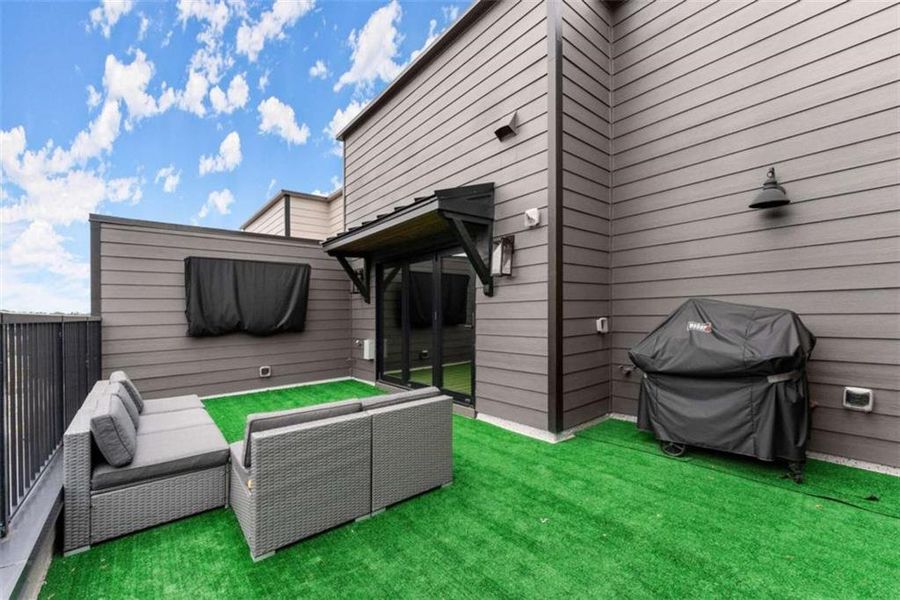 Exterior details and patio area of a home in Skyview On Broad, Sugar Hill (Image 29).