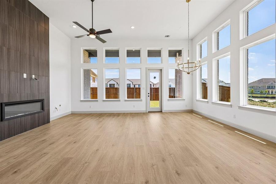 Featuring walls of windows and a stunning floor to ceiling fireplace, friends and family will love gathering in your new dream home! Featuring walls of windows and a stunning floor to ceiling fireplace, friends and family will love gathering in your new dream home!