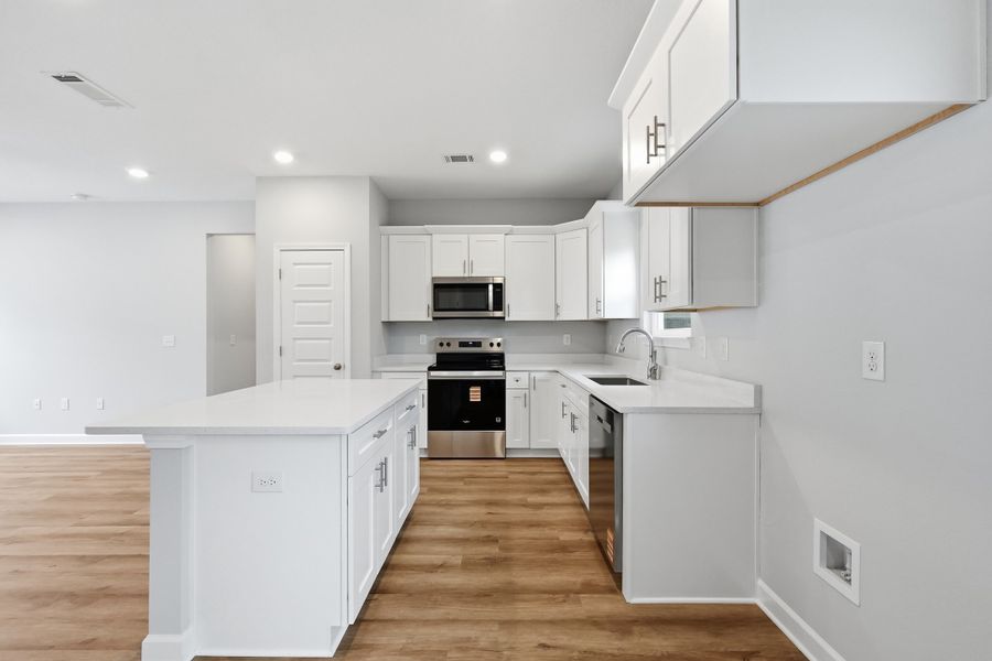 Furnished interior view inside a new home in Live Oak Cottages, Freeport (Image 5).