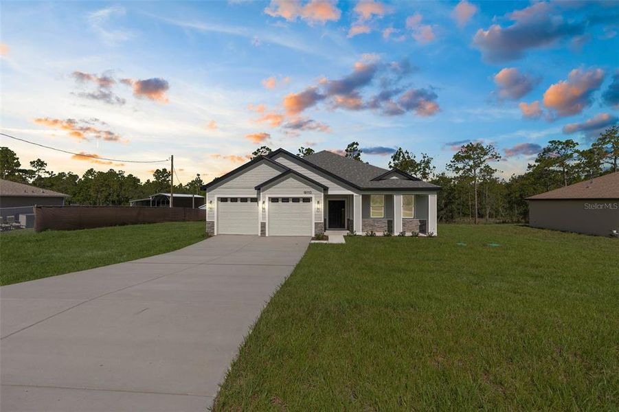 Front exterior of a new home in , Weeki Wachee, FL, highlighting curb appeal (Image 27).