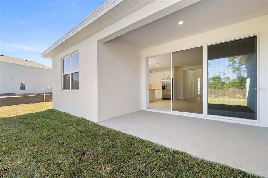Exterior details and patio area of a home in Serenade at Ovation, Winter Garden (Image 3). Exterior details and patio area of a home in Serenade at Ovation, Winter Garden (Image 3).