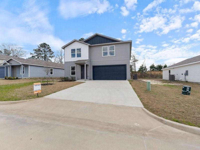 Front exterior of a new home in Shirey Forest - Branches, Lufkin, TX, highlighting curb appeal (Image 14).