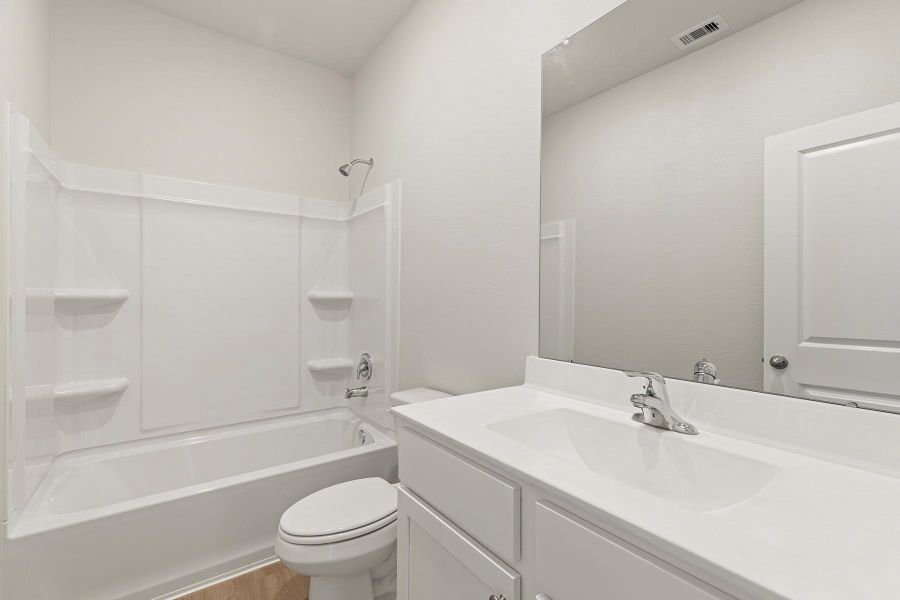 Furnished interior view inside a new home in Canterra Creek, Iowa Colony (Image 2).