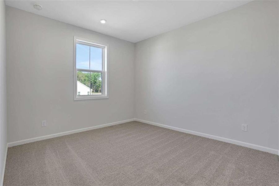 Spacious, unfurnished interior of a new home in The Paddocks at Doc Hughes, Buford (Image 46).