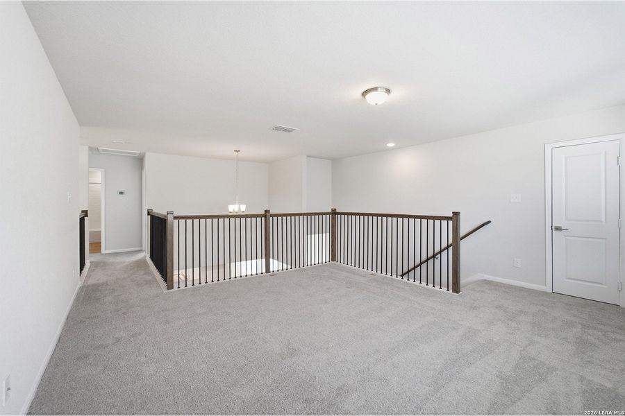 Spacious, unfurnished interior of a new home in The Woodlands at Medina Hills, Mico (Image 31).