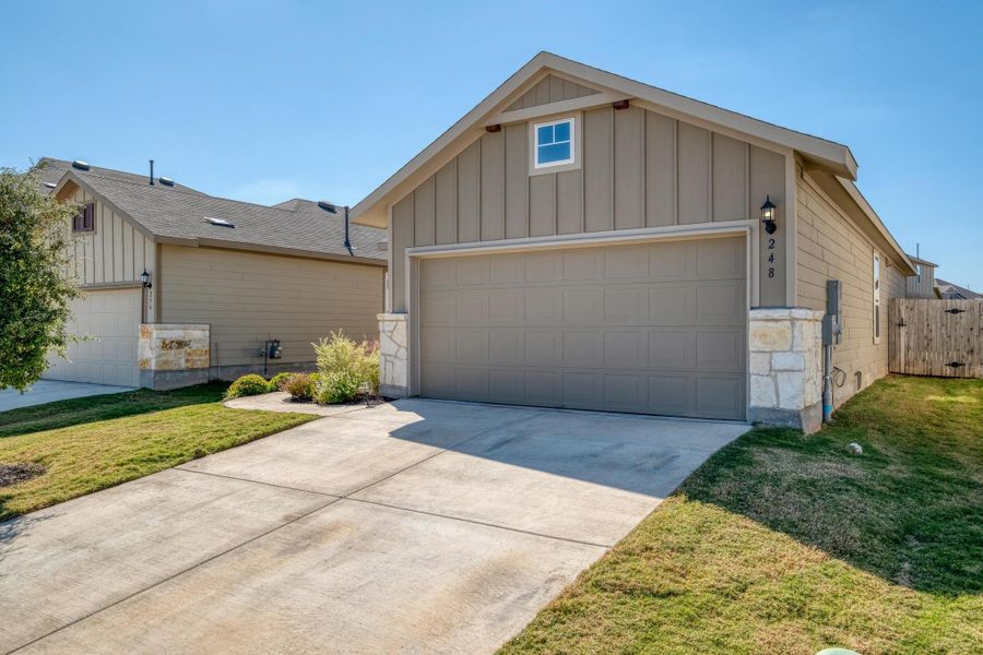 Front exterior of a new home in , Buda, TX, highlighting curb appeal (Image 22). Front exterior of a new home in , Buda, TX, highlighting curb appeal (Image 22).
