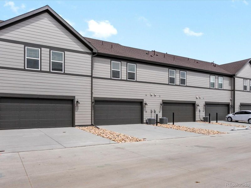 Front exterior of a new home in Poudre Heights: The Meadow Collection, Windsor, CO, highlighting curb appeal (Image 16). Front exterior of a new home in Poudre Heights: The Meadow Collection, Windsor, CO, highlighting curb appeal (Image 16).