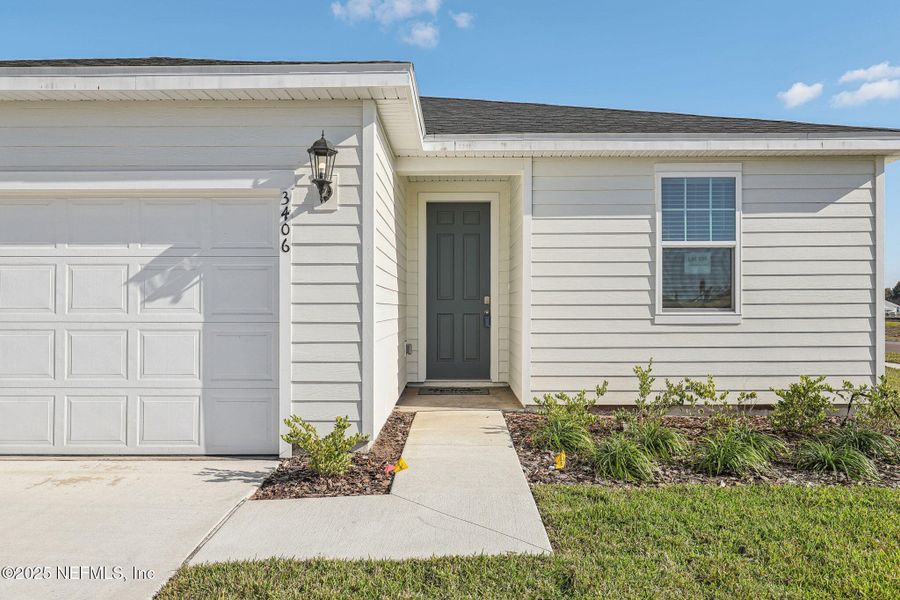 Front exterior of a new home in Lakes at Bella Lago - Signature Series, Green Cove Springs, FL, highlighting curb appeal (Image 19). Front exterior of a new home in Lakes at Bella Lago - Signature Series, Green Cove Springs, FL, highlighting curb appeal (Image 19).
