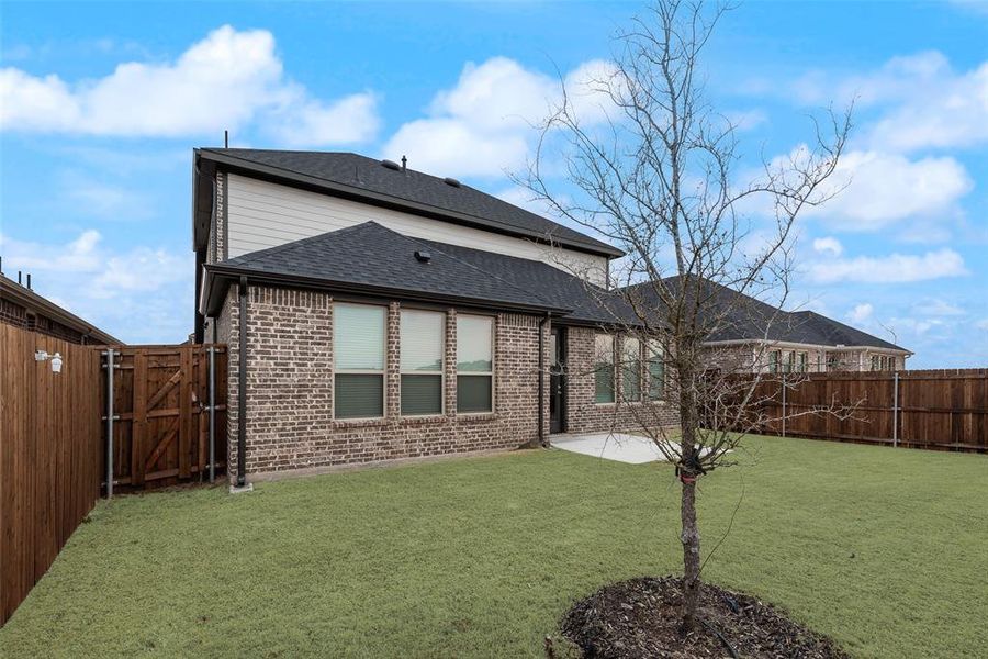 Exterior details and patio area of a home in Walden Pond, Forney (Image 4).
