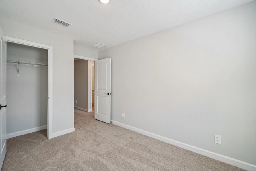 Bedroom 3 features additional closet storage
