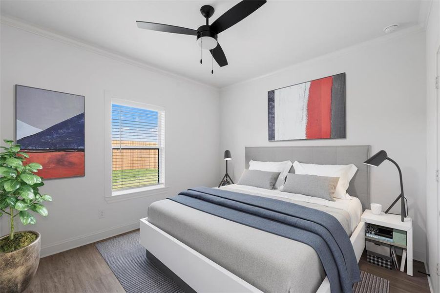 Bedroom with ornamental molding, wood finished floors, and a ceiling fan. Virtually staged Bedroom with ornamental molding, wood finished floors, and a ceiling fan. Virtually staged