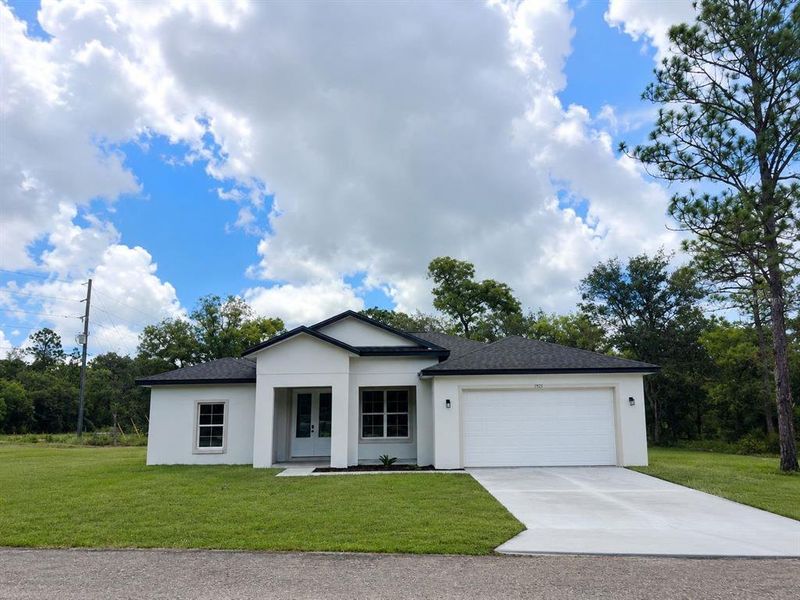 Front exterior of a new home in , Citrus Springs, FL, highlighting curb appeal (Image 2). Front exterior of a new home in , Citrus Springs, FL, highlighting curb appeal (Image 2).