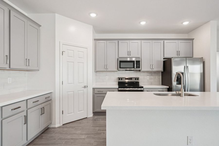 Kitchen featuring the Milan Collection. Finishes and options may vary by community
