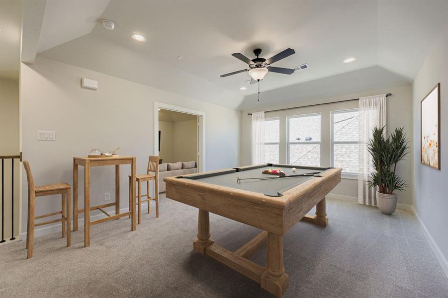 Virtually staged photo - Playroom featuring billiards table, light carpet, vaulted ceiling, a ceiling fan, and recessed lighting
