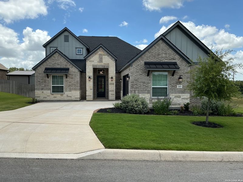 Front exterior of a new home in Potranco West, Castroville, TX, highlighting curb appeal (Image 1). Front exterior of a new home in Potranco West, Castroville, TX, highlighting curb appeal (Image 1).