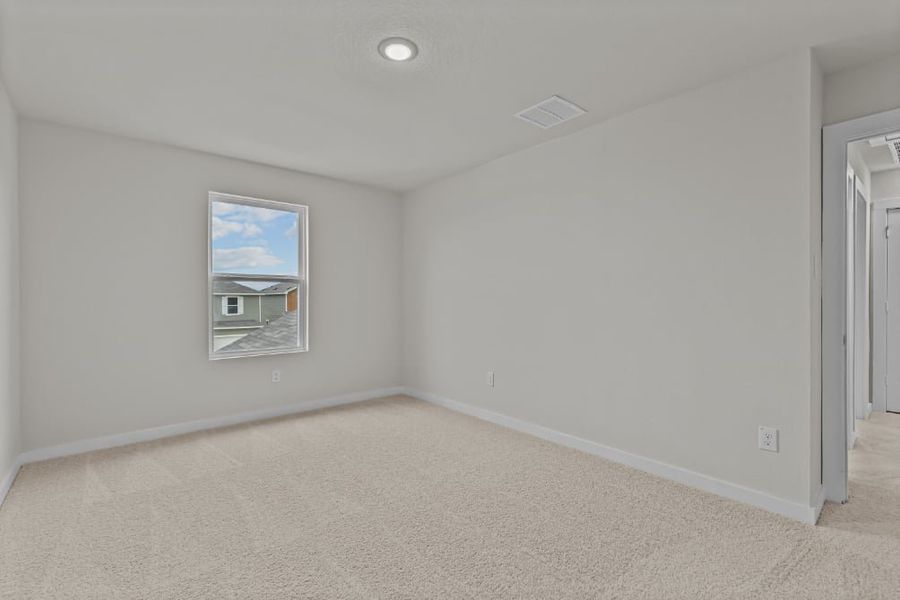 A room with a painting on the wall.