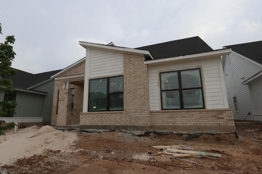 Front exterior of a new home in Indigo 50’ Homesites, Richmond, TX, highlighting curb appeal (Image 8).