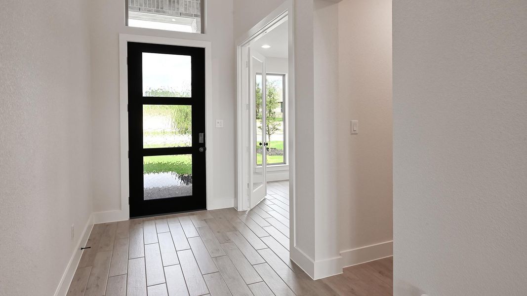 Foyer with light wood finished floors Foyer with light wood finished floors