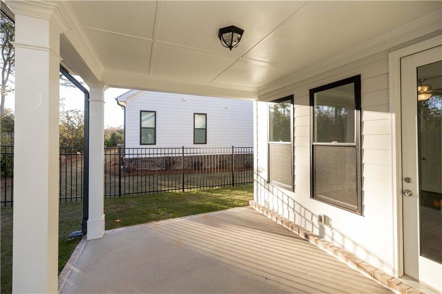 Exterior details and patio area of a home in Promenade at Sawnee Village, Cumming (Image 3).