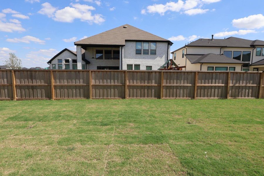 Exterior details and patio area of a home in Dunham Pointe, Cypress (Image 4).