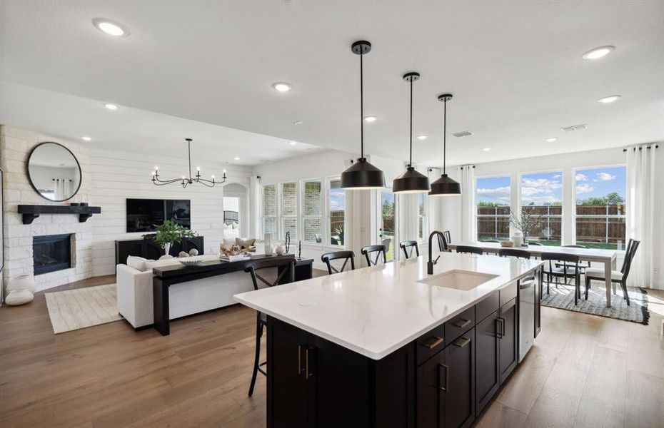 Bright kitchen with an expansive center island perfect for gatherings *Model representation Bright kitchen with an expansive center island perfect for gatherings *Model representation
