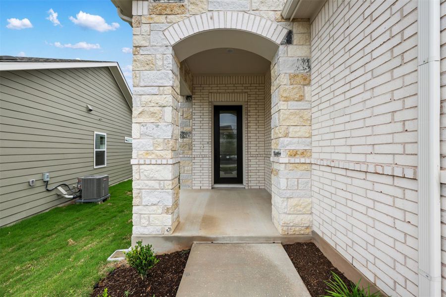 Exterior details and patio area of a home in Cannon Ranch, Dripping Springs (Image 3).