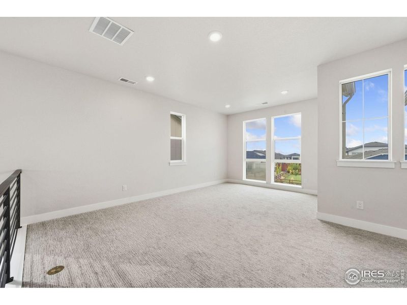 Spacious, unfurnished interior of a new home in Festival at RainDance, Windsor (Image 11).