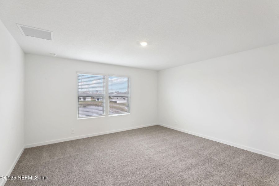 Spacious, unfurnished interior of a new home in Lakes at Bella Lago - Signature Series, Green Cove Springs (Image 11). Spacious, unfurnished interior of a new home in Lakes at Bella Lago - Signature Series, Green Cove Springs (Image 11).