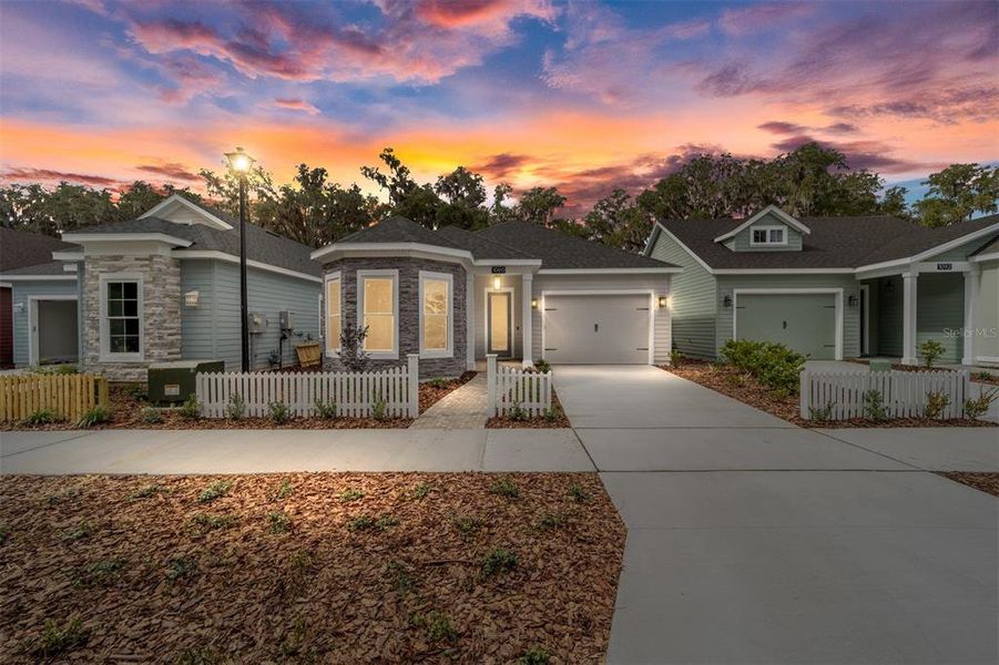 Front exterior of a new home in Fairway Pointe at West End, Newberry, FL, highlighting curb appeal (Image 27).