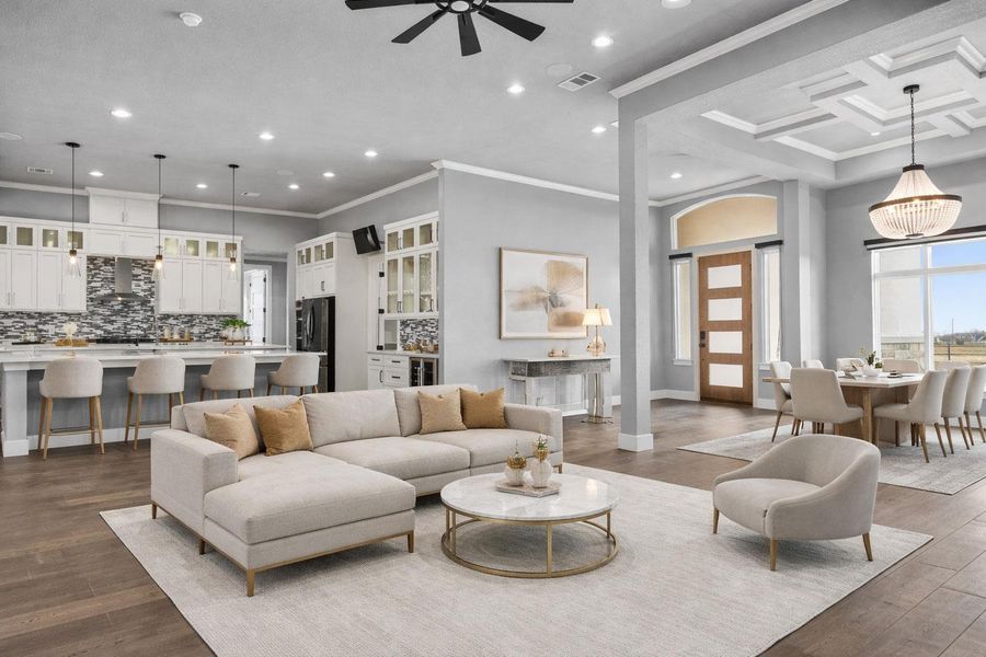 Living area with ornamental molding, coffered ceiling, recessed lighting, dark wood finished floors, and a ceiling fan