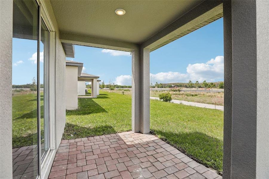 Exterior details and patio area of a home in The Meadow at Crossprairie, St. Cloud (Image 25).