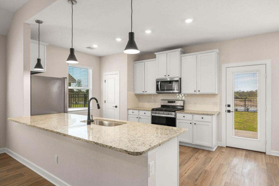 Furnished interior view inside a new home in Sunterra, Katy (Image 5).