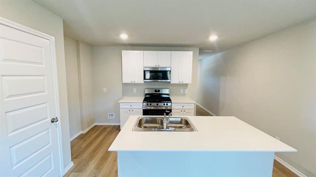 Kitchen - All Home and community information, including pricing, included features, terms, availability and amenities, are subject to change at any time without notice or obligation. All Drawings, pictures, photographs, video, square footages, floor plans, elevations, features, colors and sizes are approximate for illustration purposes only and will vary from the homes as built.
