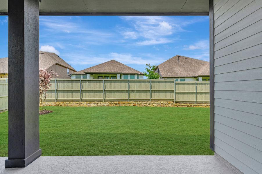 Exterior details and patio area of a home in Pecan Square - Gardens, Northlake (Image 4). Exterior details and patio area of a home in Pecan Square - Gardens, Northlake (Image 4).