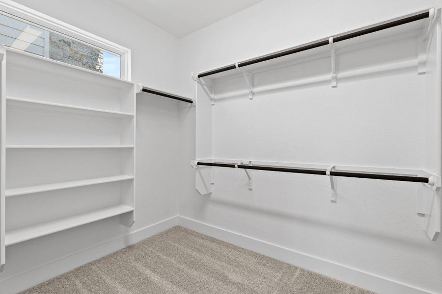 Walk-in closet in Primary Bedroom Walk-in closet in Primary Bedroom