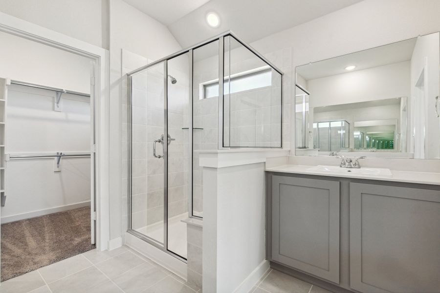 Primary bathroom in the Heisman home plan by Trophy Signature Homes – REPRESENTATIVE PHOTO