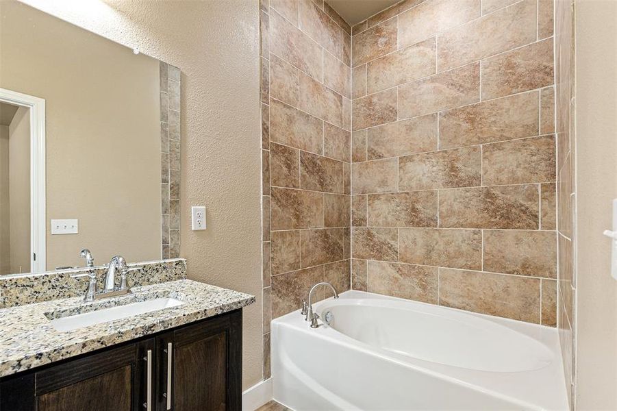 Spa tub and separate shower in the primary ensuite