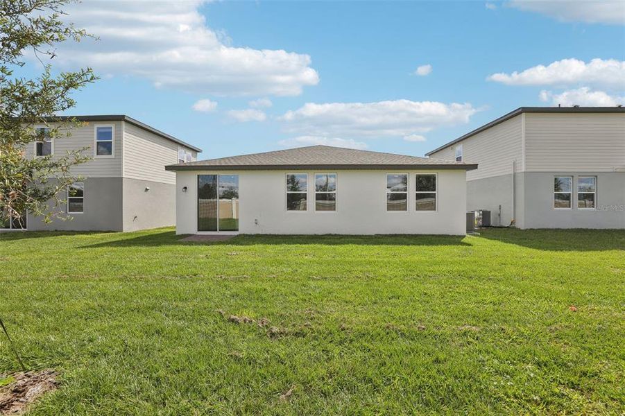 Exterior details and patio area of a home in Lawson Dunes - Signature Series, Haines City (Image 27).