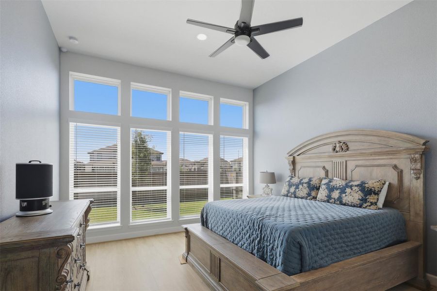Wall of windows fills the generously sized primary suite with natural light. Wall of windows fills the generously sized primary suite with natural light.