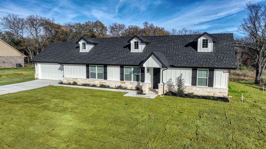 Front exterior of a new home in , Poolville, TX, highlighting curb appeal (Image 22).