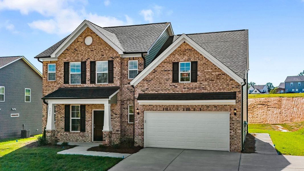 Front exterior of a new home in Brooke Hill, Lewisville, NC, highlighting curb appeal (Image 2).