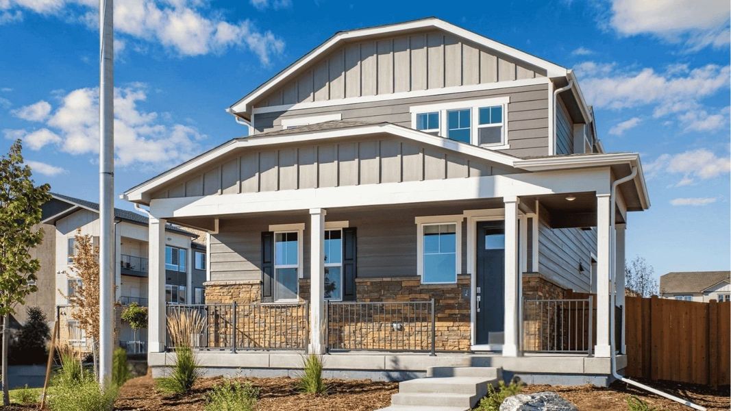 Front exterior of a new home in Sky Ranch, Watkins, CO, highlighting curb appeal (Image 1). Front exterior of a new home in Sky Ranch, Watkins, CO, highlighting curb appeal (Image 1).