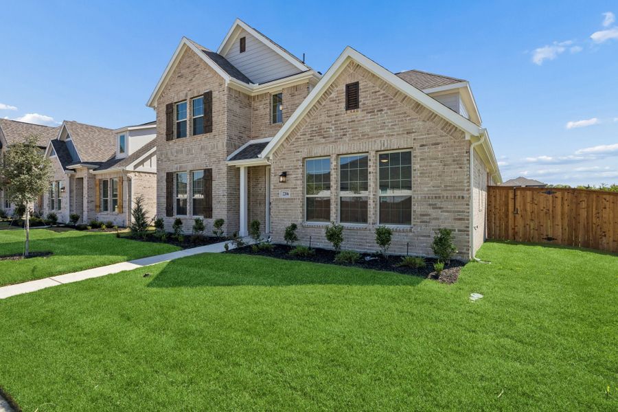 Front exterior of a new home in Dove Hollow, Waxahachie, TX, highlighting curb appeal (Image 19). Front exterior of a new home in Dove Hollow, Waxahachie, TX, highlighting curb appeal (Image 19).