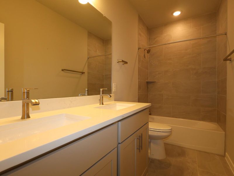 Furnished interior view inside a new home in Heritage, Dripping Springs (Image 6).