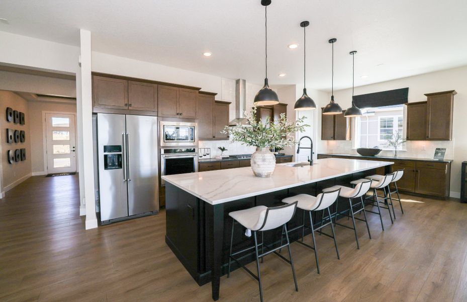 Furnished interior view inside a new home in Hilltop at Inspiration, Aurora (Image 22).