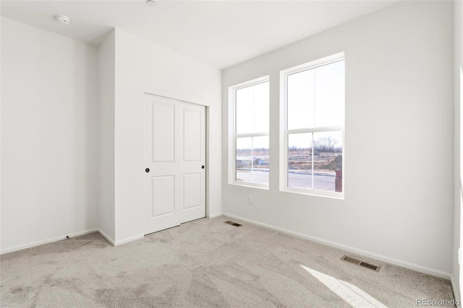 Spacious, unfurnished interior of a new home in The Nest Classic at Canyon Creek, Erie (Image 28).